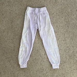 Girls purple and white sweat pants. Size: L.